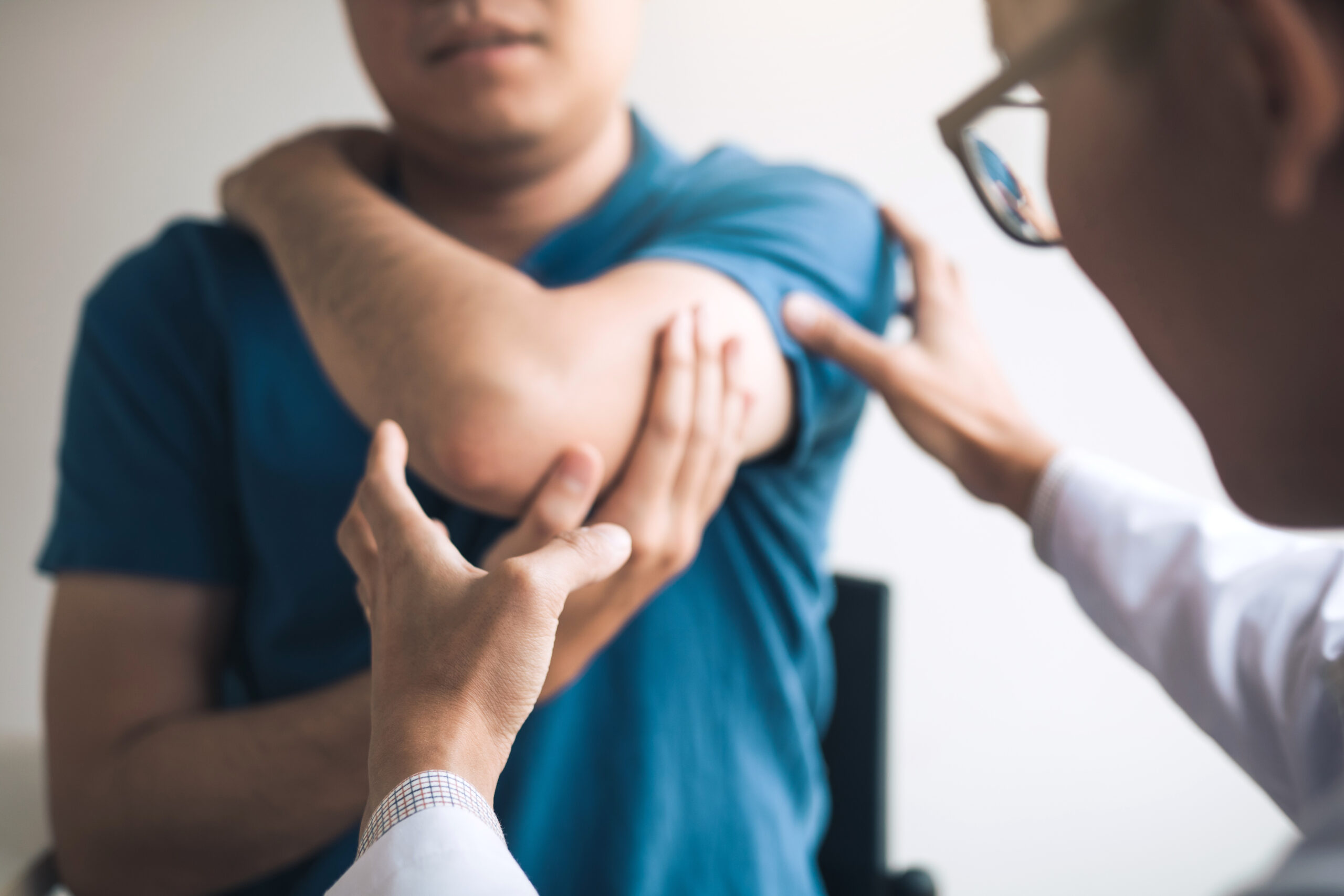 Physical therapists are checking patients elbows at the clinic o